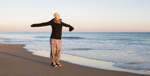 A person with cancer on the beach.