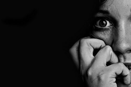 a woman looking fearful