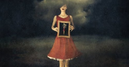 woman holding a painting that represents breaking promises