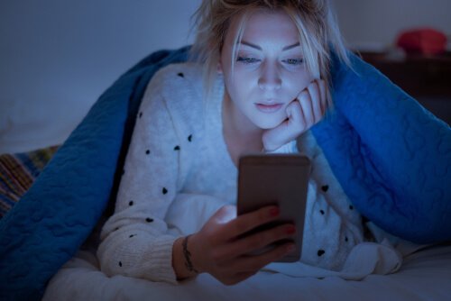 a woman looking at her phone