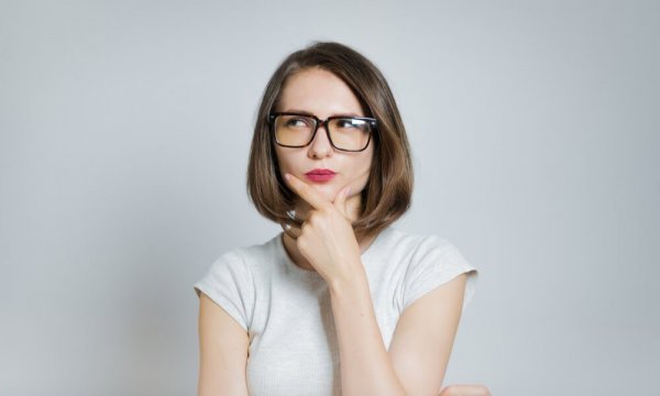 woman thinking with her hand on her chin