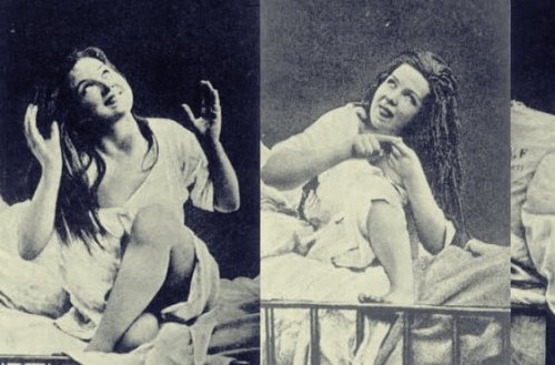 A woman with hysteria sitting on a bed.