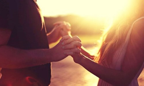 A couple holding hands.