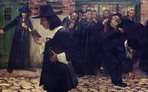 Spinoza reading in the street.