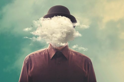 A person's face covered by clouds.