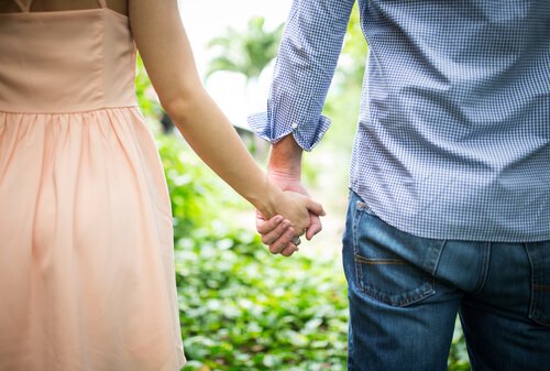 a couple holding hands