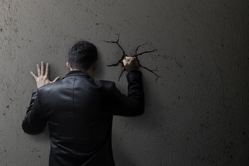 a man punching a wall