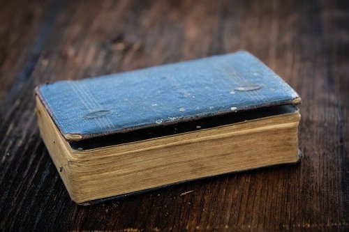 An old book on a table.