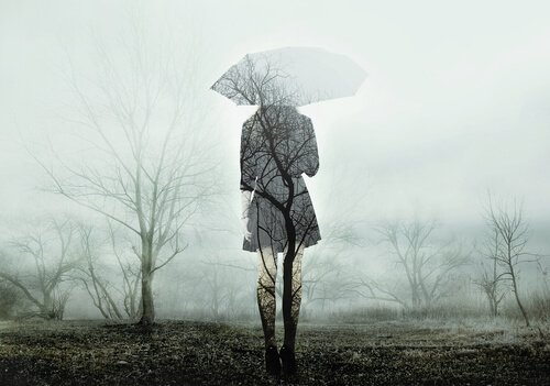 A transparent woman walking with an umbrella.