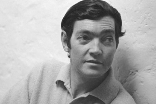 A black-and-white photo of Cortazar when he was young, showing him from the chest up.