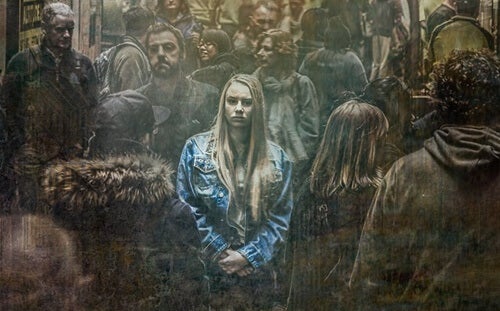 A young woman standing out from a crowd.