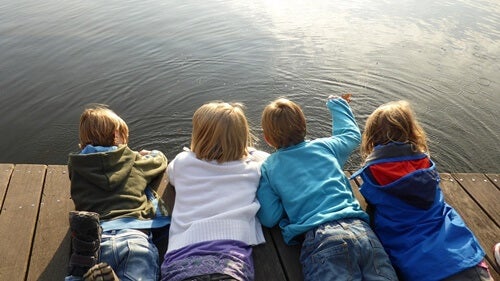 Children lying in a dock.