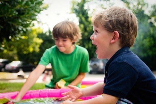 Two boys playing, one of them is excited.