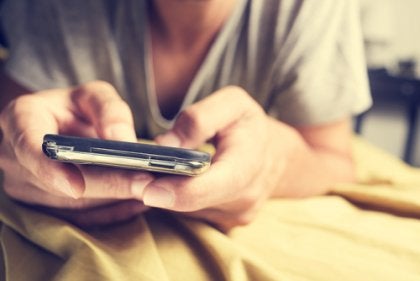 A person texting.
