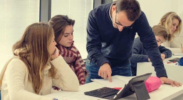 A teacher evaluating and grading a student's work.