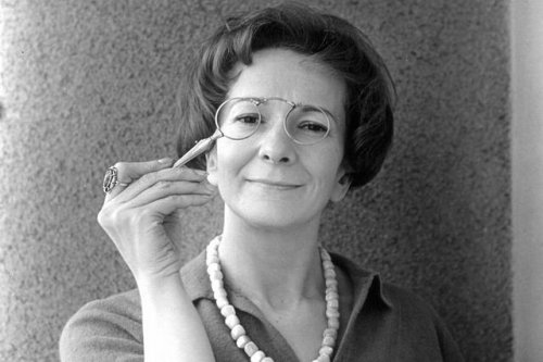 Wisława Szymborska playing with her glasses.