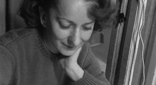 Wisława Szymborska writing.