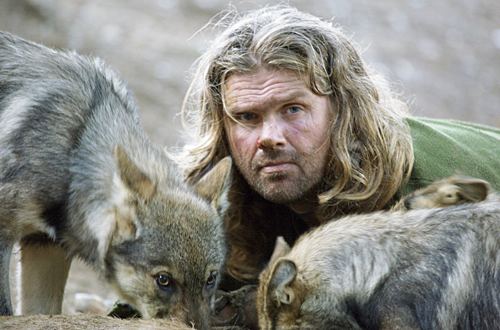 Shaun Ellis eating with wolves.