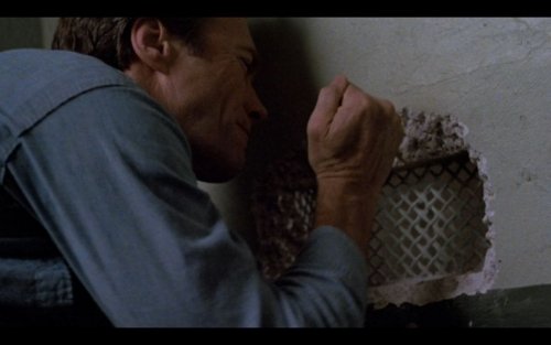 Escape from Alcatraz scene, Frank Morris digging a hole in the prison wall.