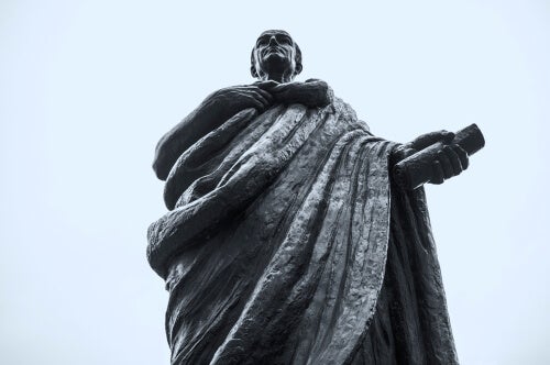 A statue of Seneca viewed from below.
