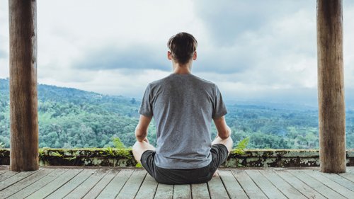 A man practicing meditation.