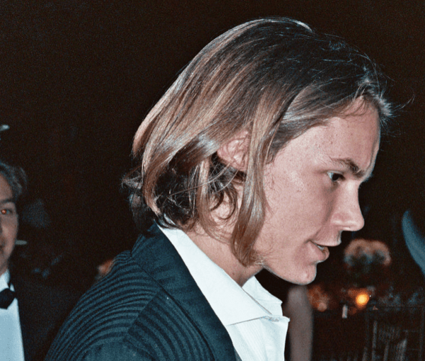 A picture of River Phoenix as an adult, in a suit. 