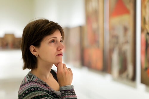 A woman looking at a picture.
