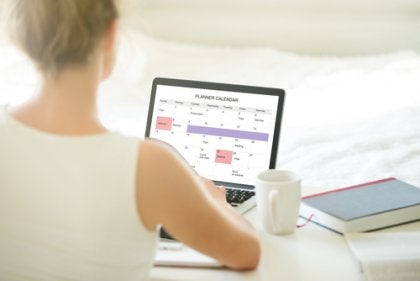 A woman working on a computer.
