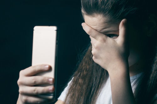 A girl who doesn't want to look at her phone.