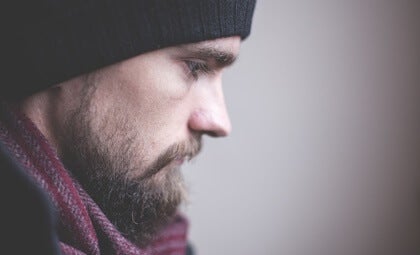 A sad bearded man.