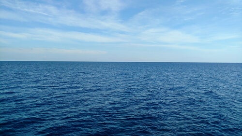 A picture of the sea looking calm.
