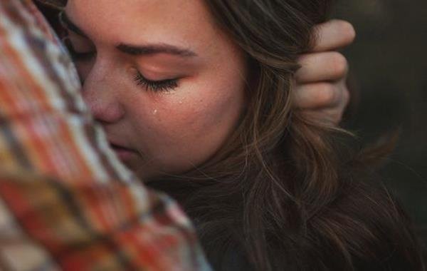 A woman crying.