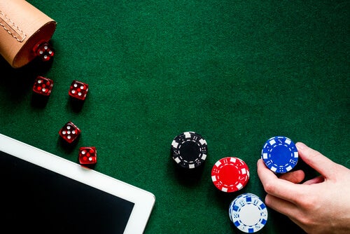 A person playing Bar Dice.