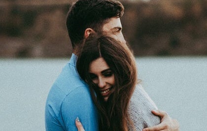 A couple hugging.