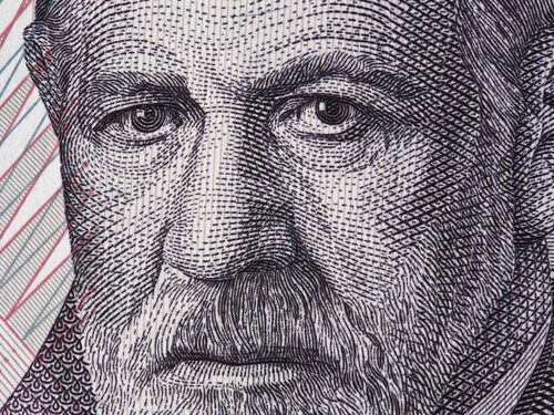 A wood print showing a close-up of Freud's face. 