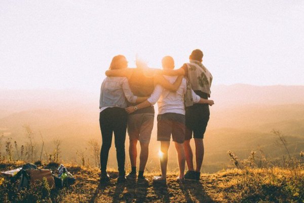 A group of men hugging.