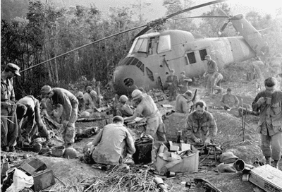 Soldiers helping each other during an insurgency.