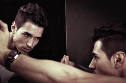 A narcissist man looking in the mirror.