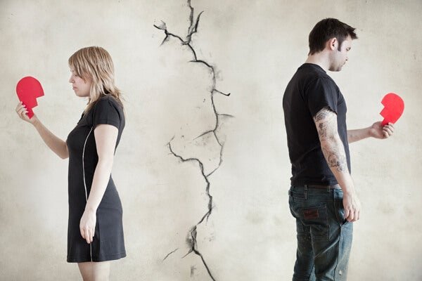 Forget a past love being symbolized by two people holding broken hearts.