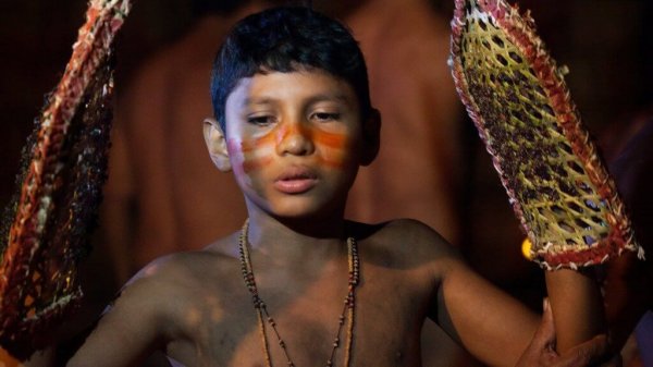 A boy taking part in one of the strangest rituals in the world.