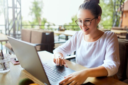 A woman using a computer.