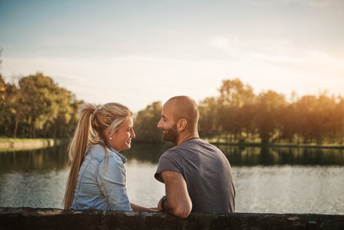 A woman and a man talking.