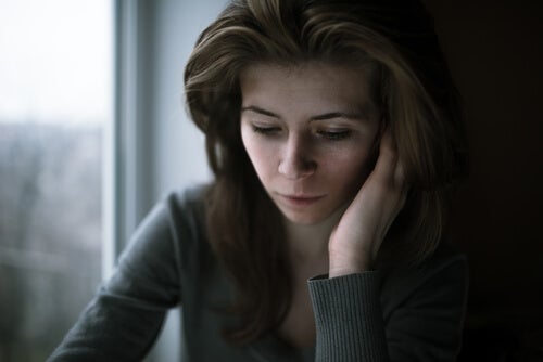 A worried woman thinking.