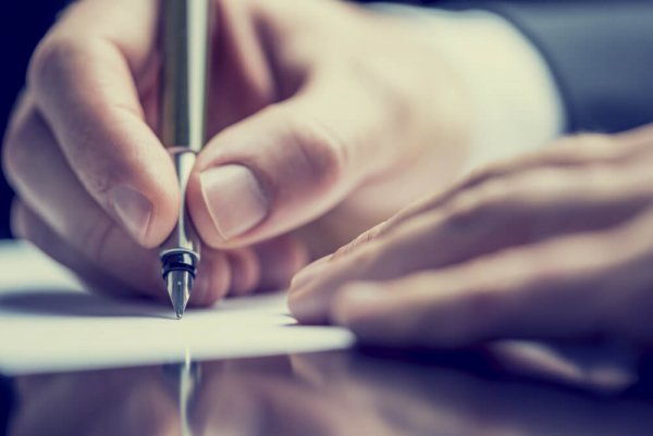 A person writing.