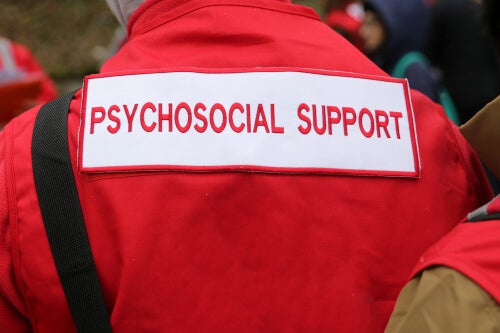 A person with a psychosocial support jacket.