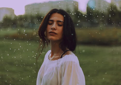 A woman enjoying the wind.