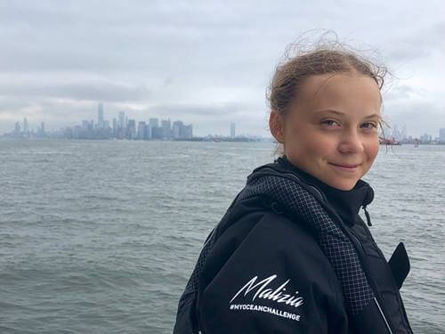 Greta Thunberg smiling.