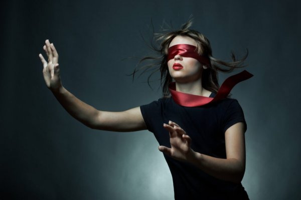 A woman with a blindfold.