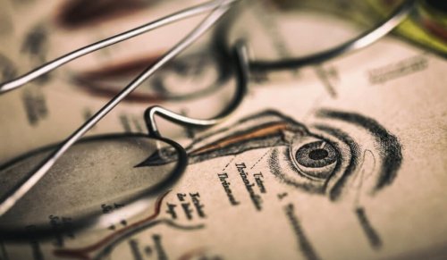 Glasses on top of a drawing about optography.