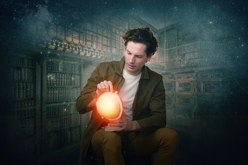 A man holding a glowing orb. 